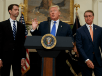 President Donald Trump, flanked by Sen. Tom Cotton, R- Ark., left, and Sen. David Perdue, R-Ga., speaks in the Roosevelt Room of the White House in Washington, Wednesday, Aug. 2, 2017, during the unveiling of legislation that would place new limits on legal immigration. (AP Photo/Evan Vucci)