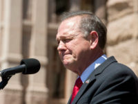 Controversial Alabama Supreme Court Chief Justice Roy Moore speaks at a rally of conservative Texas legislators opposing gay marriage at a Texas Capitol rally Monday. Moore has told Alabama judges to ignore a recent federal court ruling allowing gay marriage in the state. (Photo by Robert Daemmrich Photography Inc/Corbis via Getty Images)