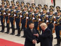 In this Nov. 9, 2017, file photo, President Donald Trump and Chinese President Xi Jinping participate in a welcome ceremony at the Great Hall of the People in Beijing, China. Trump couldn’t seem to stop talking about the red carpets, military parades and fancy dinners that were lavished upon him during “state visits” on his recent tour of Asia. “Magnificent,” he declared at one point on the trip. But Trump has yet to reciprocate in kind. In fact, he is the first president in decades to close his first year in office without welcoming a counterpart on a visit to the U.S. with similar trappings. (AP Photo/Andrew Harnik, File)
