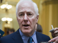 In this July 27, 2017, file photo, Senate Majority Whip John Cornyn of Texas talks to reporters as heads to the Senate on Capitol Hill in Washington. Top Senate Republicans think it’s time to leave their derailed drive to scrap the Obama health care law behind them. And they’re tired of the White House prodding them to keep voting until they succeed. (AP Photo/Cliff Owen)