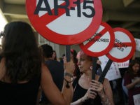 FORT LAUDERDALE, FL - FEBRUARY 17: Mercedes Kent joins other people after a school shooting that killed 17 to protest against guns on the steps of the Broward County Federal courthouse on February 17, 2018 in Fort Lauderdale, Florida. Earlier this week former student Nikolas Cruz opened fire with a AR-15 rifle at the Marjory Stoneman Douglas High School killing 17 people. (Photo by Joe Raedle/Getty Images)