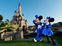 Disney characters Mickey and Mini mouse pose in front of the Sleeping Beauty Castle to mark the 25th anniversary of Disneyland - originally Euro Disney Resort - on March 16, 2017 in Marne-La-Vallee, east of the French capital Paris. The 25th anniversary celebrations will begin on March 26, 2017 with parades, various shows and a firework's display. / AFP PHOTO / BERTRAND GUAY (Photo credit should read BERTRAND GUAY/AFP/Getty Images)