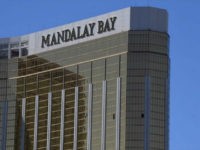 TOPSHOT - The damaged windows on the 32nd floor room that was used by the shooter in the Mandalay Hotel after a gunman killed at least 58 people and wounded more than 500 others when he opened fire on a country music concert in Las Vegas, Nevada on October 2, 2017. Police said the gunman, a 64-year-old local resident named as Stephen Paddock, had been killed after a SWAT team responded to reports of multiple gunfire from the 32nd floor of the Mandalay Bay, a hotel-casino next to the concert venue. / AFP PHOTO / Mark RALSTON (Photo credit should read MARK RALSTON/AFP/Getty Images)