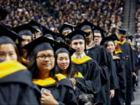 Graduates of Baruch College participate in a commencement program at Barclays Center, Monday, June 5, 2017, in the Brooklyn borough of New York. (AP Photo/Bebeto Matthews)